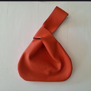 Orange leather Japanese knot bag in small handy size, for telephone, keys, cards